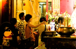Visitors burn incense in Man Mo Temple
